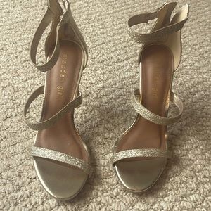 4 inch gold strappy madden girl heels. Straps have elastic to fit wider feet.EUC